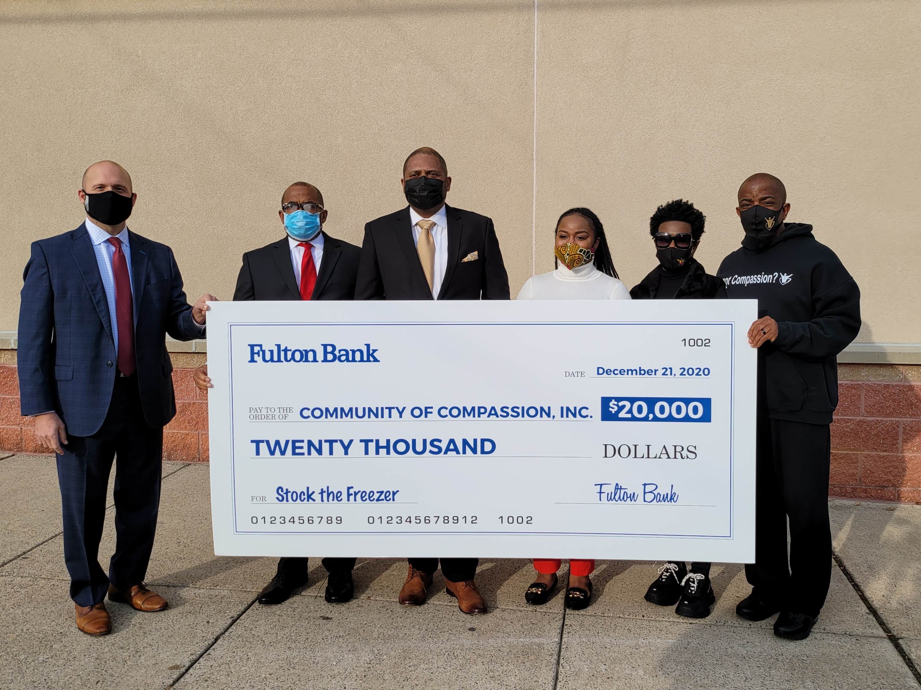 Swiftvest Bank check presentation for "Stock the Freezer" Initiative